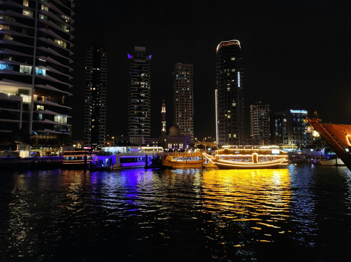 Dhow cruise boats lit up in Dubai Marina