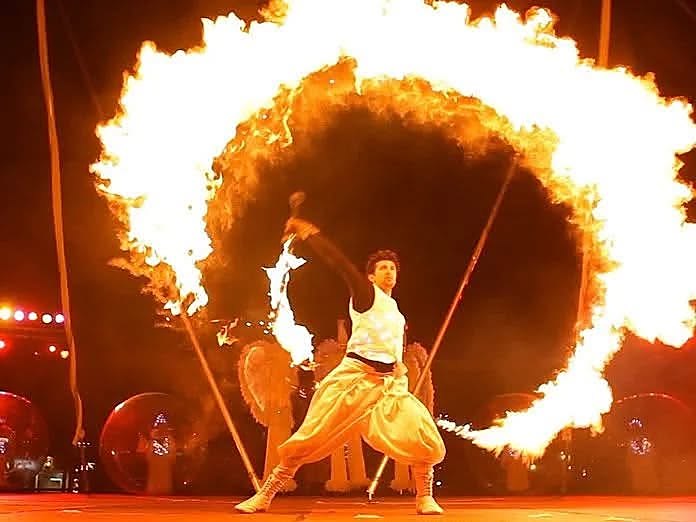 Fire show performer at the desert camp